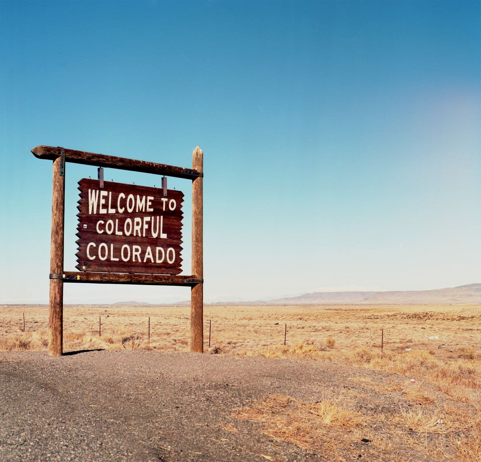 The Welcome to Colorful Colorado state-line sign, on the return drive to Denver